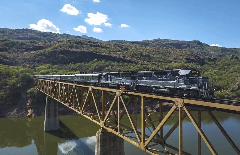 Passenger train crossing a bridge in Copper Canyon
